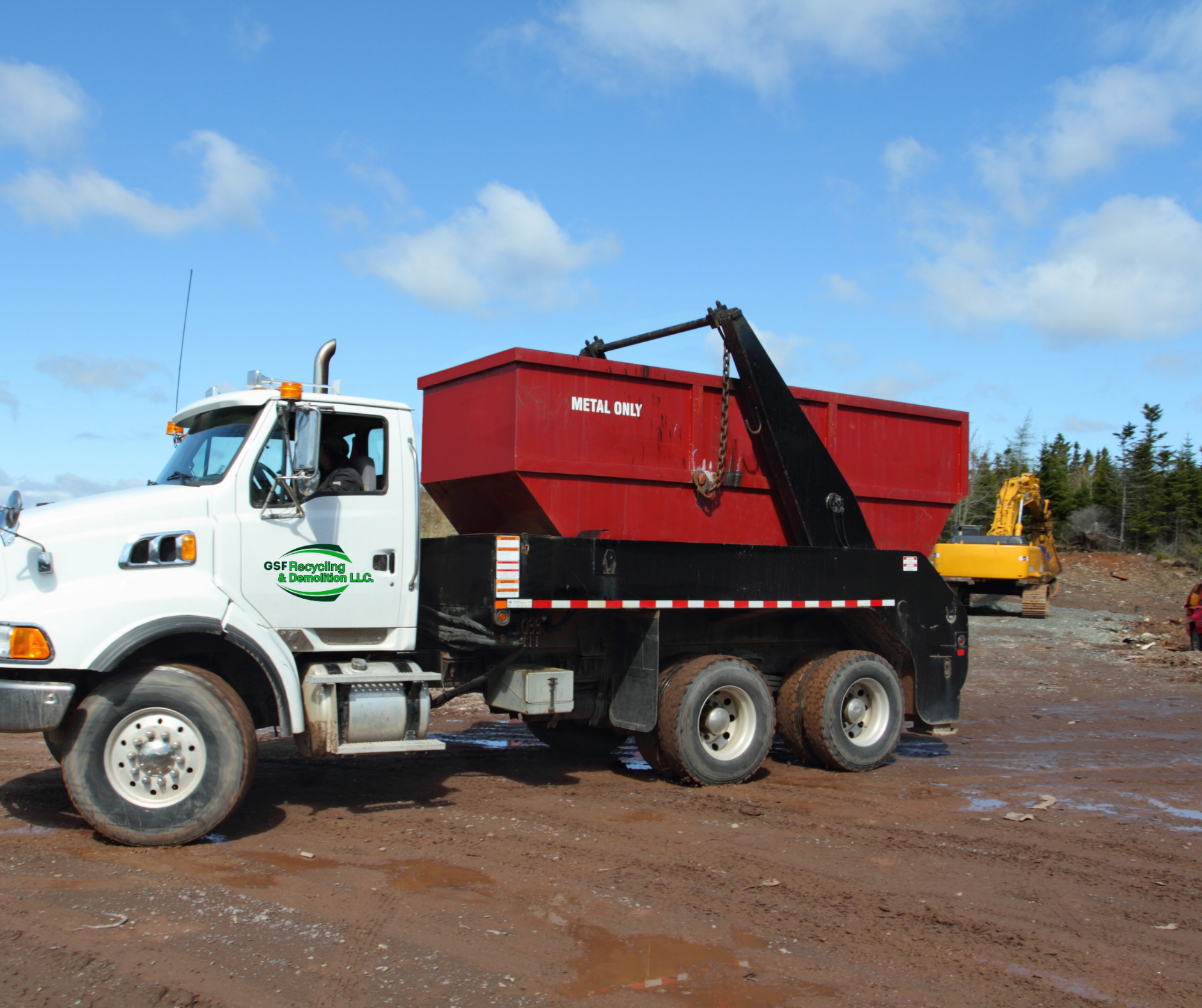Roll-off dumpsters at a commercial site